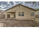 House backyard with covered patio and block wall at 2524 W Saint Catherine Ave, Phoenix, AZ 85041