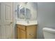 Bathroom with single sink vanity and toilet at 2524 W Saint Catherine Ave, Phoenix, AZ 85041