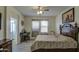 Main bedroom with ceiling fan and large bed at 2524 W Saint Catherine Ave, Phoenix, AZ 85041