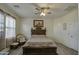 Main bedroom with ceiling fan and large bed at 2524 W Saint Catherine Ave, Phoenix, AZ 85041