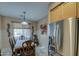 Dining area with wood table and chairs, and a stainless steel refrigerator at 2524 W Saint Catherine Ave, Phoenix, AZ 85041