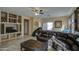 Living room with leather furniture and built-in shelving at 2524 W Saint Catherine Ave, Phoenix, AZ 85041