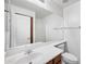 Bright bathroom featuring a large mirror, white sink, and toilet at 2646 E Megan St, Gilbert, AZ 85295