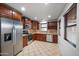 Kitchen featuring stainless steel appliances, ample counter space and dark wooden cabinetry at 2646 E Megan St, Gilbert, AZ 85295