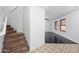 Open-concept living room featuring sleek floors, a staircase, and plenty of natural light at 2646 E Megan St, Gilbert, AZ 85295