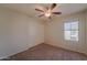 Spacious bedroom with ceiling fan, carpet, and double closets at 2960 E Darrow St, Phoenix, AZ 85042