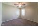 Well-lit bedroom with ceiling fan and carpet flooring at 2960 E Darrow St, Phoenix, AZ 85042