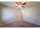 Bedroom with ceiling fan, carpet, and access to hallway at 2960 E Darrow St, Phoenix, AZ 85042