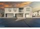 Two-story townhome with attached garage and balcony, under a sunset sky at 2960 E Darrow St, Phoenix, AZ 85042