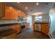 Modern kitchen with dark wood cabinets and granite countertops at 2960 E Darrow St, Phoenix, AZ 85042