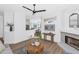 Bright living room featuring a fireplace, modern decor, and an open layout into the dining area at 2992 N Miller Rd # 210A, Scottsdale, AZ 85251