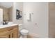 Clean bathroom with a toilet, vanity, and shower at 2992 N Miller Rd # 210A, Scottsdale, AZ 85251