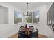 Small dining area with wood table and four chairs, near kitchen at 2992 N Miller Rd # 210A, Scottsdale, AZ 85251