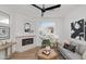 Light and airy living room with fireplace, hardwood floors and large window at 2992 N Miller Rd # 210A, Scottsdale, AZ 85251