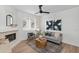 Living room with hardwood floors, fireplace, and neutral-toned furniture at 2992 N Miller Rd # 210A, Scottsdale, AZ 85251