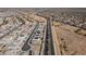 Expansive aerial view of a Primary-planned community showcasing the neatly arranged homes and surrounding landscape at 30968 W Monterey Ave, Buckeye, AZ 85396