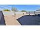 Spacious gravel backyard featuring desert landscaping and a block wall at 30968 W Monterey Ave, Buckeye, AZ 85396