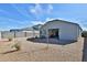 View of the backyard with gravel and small plants at 30968 W Monterey Ave, Buckeye, AZ 85396