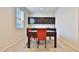 Bright dining area with a window and dark wood cabinetry at 30968 W Monterey Ave, Buckeye, AZ 85396