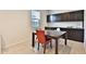 Dining area with a table and dark wood cabinetry at 30968 W Monterey Ave, Buckeye, AZ 85396