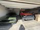 Well-organized garage with vehicles and overhead storage at 30968 W Monterey Ave, Buckeye, AZ 85396