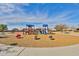 Colorful playground with various play structures, benches, and safety mulch surfacing at 30968 W Monterey Ave, Buckeye, AZ 85396