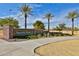 Attractive 'Sports Park' signage with stone accents, manicured landscaping, and clear blue sky at 30968 W Monterey Ave, Buckeye, AZ 85396