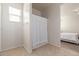 Bathroom with shower and view into bedroom at 31045 W Cheery Lynn Rd, Buckeye, AZ 85396