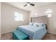 King-size bedroom with large window and bench at 31045 W Cheery Lynn Rd, Buckeye, AZ 85396