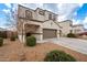 Two-story house with a three-car garage and front yard at 31045 W Cheery Lynn Rd, Buckeye, AZ 85396