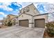 Two-story house with a three-car garage and driveway at 31045 W Cheery Lynn Rd, Buckeye, AZ 85396