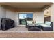 Covered patio with seating and grill at 31045 W Cheery Lynn Rd, Buckeye, AZ 85396