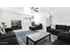 Bright living room features a large sectional sofa, patterned rug, and a wall-mounted television at 3352 E Hopi Ave, Mesa, AZ 85204