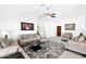 Spacious living room with a ceiling fan and contemporary furniture at 3352 E Hopi Ave, Mesa, AZ 85204