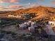 Aerial view of a luxury home with tile roof and desert landscaping, on a hilltop lot at 36430 N 34Th Ave, Phoenix, AZ 85086