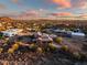 Aerial view of luxury home with tile roof and covered patio; expansive desert views at 36430 N 34Th Ave, Phoenix, AZ 85086