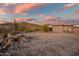 House with desert landscape and sunset sky at 36430 N 34Th Ave, Phoenix, AZ 85086