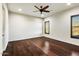 Well-lit bedroom featuring hardwood floors and plantation shutters at 36430 N 34Th Ave, Phoenix, AZ 85086