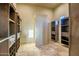 Large walk-in closet with built-in shelves and drawers at 36430 N 34Th Ave, Phoenix, AZ 85086