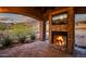 Outdoor patio with fireplace and mountain views at 36430 N 34Th Ave, Phoenix, AZ 85086