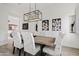 Modern dining room with a sleek table, statement lighting and art at 3990 E Alameda Ln, Gilbert, AZ 85298