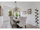 Bright dining room with a wood table and stylish chairs at 3990 E Alameda Ln, Gilbert, AZ 85298