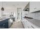 Bright kitchen featuring white cabinets, an island, and stainless steel appliances at 3990 E Alameda Ln, Gilbert, AZ 85298