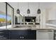 Modern kitchen island with marble countertop and stainless steel appliances at 3990 E Alameda Ln, Gilbert, AZ 85298