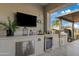 Outdoor kitchen with grill, refrigerator, and ample counter space at 3990 E Alameda Ln, Gilbert, AZ 85298