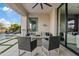 Relaxing outdoor patio with seating area and a view of the pool at 3990 E Alameda Ln, Gilbert, AZ 85298