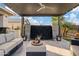 Covered patio with seating area and water feature at 3990 E Alameda Ln, Gilbert, AZ 85298