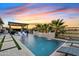 Stunning pool with pergola, lounge chairs, and water features at 3990 E Alameda Ln, Gilbert, AZ 85298