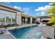 Inviting pool area with a patio, water feature and modern landscaping at 3990 E Alameda Ln, Gilbert, AZ 85298