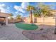 Home with a backyard, putting green, and patio area at 4248 E Raven Rd, Phoenix, AZ 85044